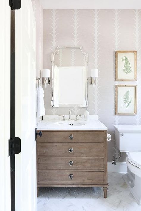 Restoration Hardware Maison Single Vanity in a transitional bathroom designed white marble countertop, glass and nickel sconces, and a French mirror. Bathroom Wall Sconces Single Vanity, Restoration Hardware Maison, Restoration Hardware Bathroom, Herringbone Wall Tile, Restoration Hardware Vanity, Modern Bathroom Art, Marble Herringbone Tile, Plant Bathroom, Transitional Bathroom Design