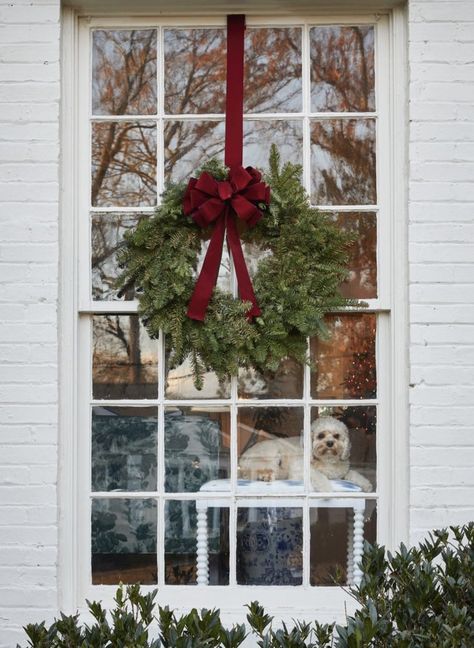 Christmas Wreath For Window, Classic Christmas Exterior Decorations, Christmas Wreaths On House Windows, House With Christmas Wreaths On Windows, Wreath On Every Window, Wreaths On French Doors, Bay Window Christmas Decor Outdoor, Outdoor Wreaths On House Windows, Wreath Above Garage Door