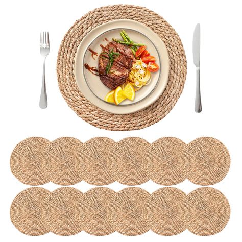 PRICES MAY VARY. Handcrafted Quality: Our wicker placemat set of 12 is made by experienced artisans from natural water hyacinth, ensuring each round woven placemat is a unique piece of art. Enhance your dining table with these 13.5-inch circle placemats that perfectly fit most of the plates. Natural Aesthetic: These boho rattan chargers for dinner plates add a touch of elegance and durability, and bring a natural vibe that adds warmth and rustic beauty to any table setting. Perfect for both ever Wicker Charger Plates Table Settings, Woven Chargers Wedding, Wicker Charger Wedding, Rattan Charger Wedding, Wicker Placemats Wedding, Rattan Charger, Woven Placemats, Water Hyacinth, Table Placemats