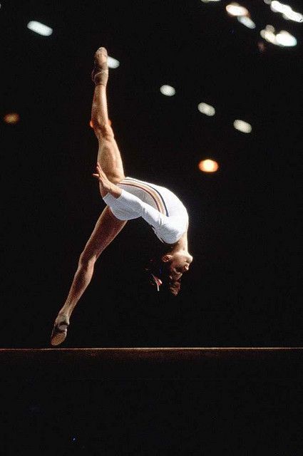 Nadia Comaneci - Perfect 10  "I don't run away from a challenge because I am afraid. Instead, I run toward it because the only way to escape fear is to trample it beneath your feet." -Nadia Comaneci, Nadia Comaneci Perfect 10, 1976 Olympics, Thomas Carlyle, Nadia Comaneci, Gymnastics Photography, Gymnastics Pictures, Olympic Gymnastics, Balance Beam, Artistic Gymnastics