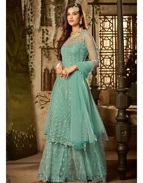 social get together wearing this Graceful Sea Blue Sharara Style Suit. This suit set is soft against the skin and comfortable to wear all day long. This Sharara Suit Set comes with Net Embroidered Top and Bottom with matching Santoon Inner Along with Net Dupatta with four side Border Pakistani Sharara Suit, Pakistani Sharara, Green Sharara, Floor Length Anarkali, Frock Designs, Designer Anarkali Suits, Frock Style, Suit Blue, Designer Suit