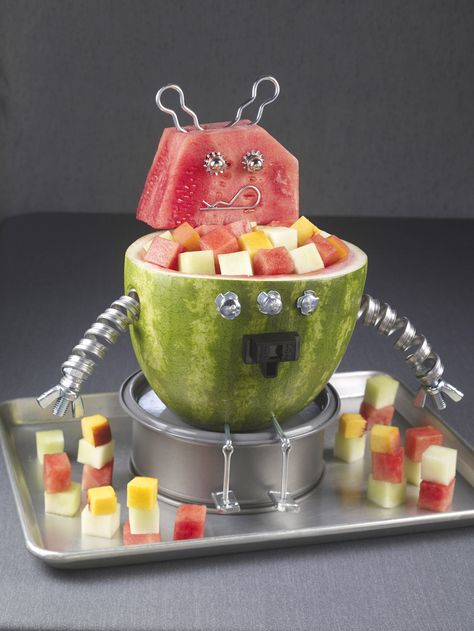 How to Carve a Watermelon Robot · Edible Crafts | CraftGossip.com Robot Party Food, Watermelon Sculpture, Science Party Food, Watermelon Hacks, Robot Cake, Watermelon Bowl, Robot Birthday Party, Watermelon Art, Yummy Dishes