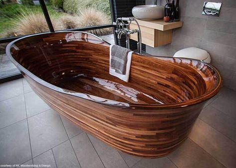 Our final favorite find from KBIS this year may be the most beautiful one. This gorgeous bathtub, part of the Lotus Bath Collection by NK Woodworking & Design, is handcrafted from sustainable hardwoods and finished with a specialized clear composite barrier. #housetrends Custom Bathtub, Wood Tub, Wood Bathtub, Wooden Bathtub, Beautiful Bathtubs, Wood Bath, Wooden Bath, Bathtub Design, Outdoor Bathrooms