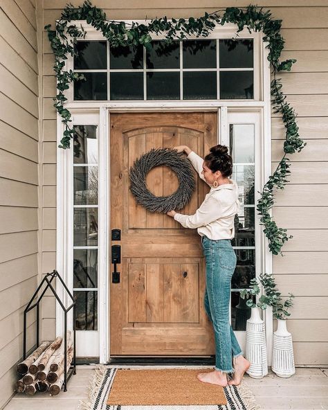 decorating home after Christmas, eucalyptus garland, lavender wreath, log bin, front porch decor, wood door, entryway, high waisted jeans @prettyinthepines Christmas Eucalyptus, Craftsman Front Door, Brown Front Doors, Pretty In The Pines, Building A Patio, Porch Doors, Lavender Wreath, Door Entryway, Wood Front Doors