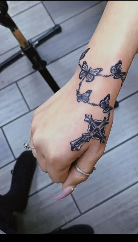 Cross Necklace Tattoos For Women, Wrap Around Wrist Tattoos Black Women, Cross Necklace Tattoo On Hand, Rosary On Hand Tattoo, Hand Cross Tattoos For Women, Rosary Hand Tattoos, Butterfly Rosary Tattoo, Rosary Hand Tattoos For Women, Wrist Tattoos For Women Wrap Around