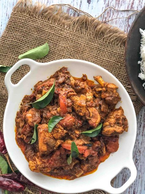 Kerala Chicken Roast Recipe is a no fuss recipe that is loaded with flavours. Chicken is marinated in spices and cooked in a onion tomato gravy. The fiery red colour and the delicious gravy of the chicken curry is sure to impress you as well. An easy and super tasty chicken roast that would be perfect for any occasion; you actually don’t even need an occasion to make this yummy dish.  Serve Kerala Chicken Roast along with Malabar Parotta, Steamed Rice, Pineapple Rasam and a Cabbag Kerala Chicken Recipes, Kerala Chicken Curry, Chicken Roast Recipe, Chicken Recipes For Dinner, Recipes With Chicken And Peppers, Chicken Roast, Kerala Food, Roast Recipe, Recipes For Dinner