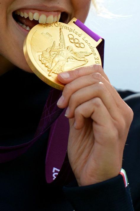 LONDON - AUGUST 04: Jessica Rossi of Italy bites the gold medal on the podium during the medal ceremony for the Women's Trap Shooting Finals on Day 8 of the London 2012 Olympic Game at the Royal Artillery Barracks on August 4, 2012 in London, England. (Photo by Lars Baron/Getty Images) 2012 Getty Images Fencing Sport, Sports Medals, 2012 Summer Olympics, Gymnastics Team, Usa Gymnastics, Olympic Gold Medals, Olympic Medals, Olympic Gymnastics, Artistic Gymnastics