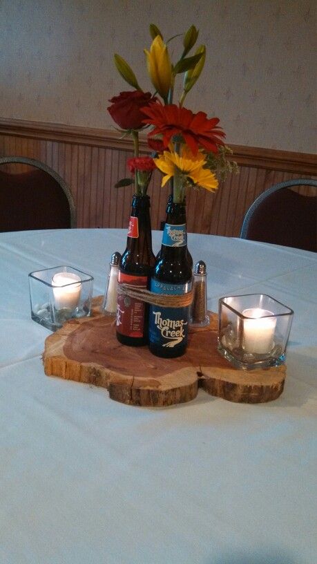 Beer bottle centerpiece I made for my brother's rehearsal dinner.... Beer Bottle Centerpieces, Beer Decorations, Beer Dinner, Dinner Centerpieces, Bottle Centerpieces, Beer Theme, Anniversary Dinner, Beer Bottles, Dinner Decoration