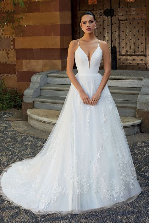 This simple yet glamorous gown features a Satin bodice with plunging V-neckline and spaghetti straps that flow into the sexy low back. The lace embellished Princess cut Tulle skirt features a Chapel train. Optional removable Puff sleeves add a unique touch. | simple wedding dress,classic wedding dress, classic bride, lace wedding dress, tulle wedding dress, bride to be, bridal gown, bridal style, wedding gown, princess wedding dress, a-line wedding dress Dress Preservation, Wedding Dress Preservation, Sparkly Wedding Dress, Sparkly Wedding, Pink Wedding Dresses, Princess Wedding Dress, Classic Wedding Dress, A Line Wedding Dress, Chapel Train