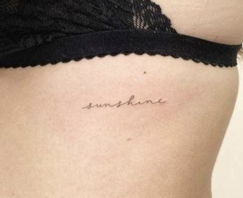 “sunshine” rib tattoo Sunshine Rib Tattoo, Sunshine Script Tattoo, Minimal Sunshine Tattoo, Sunshine Word Tattoo Fonts, Sunshine Cursive Tattoo, You Are My Sunshine Tattoo Ribs, You Are My Sunshine Rib Tattoo, Delicate Rib Tattoos For Women, Danty Tattoos Women