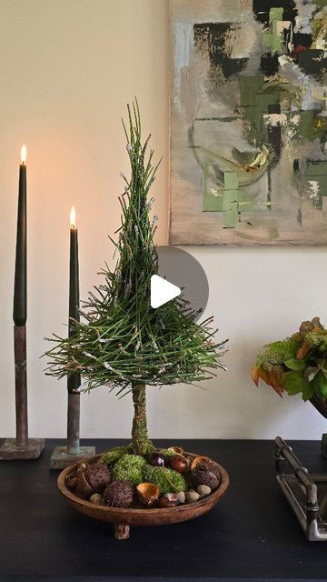 Hanne Utoft Floral design on Instagram: "Pine needles become a sculptural tree with frosty look.  #hanneutoft #pine #christmas #christmastree #pinetree #chestnuts #moss #nordicchristmas #floralarrangement #juletræ #fyrnåle #wire #metal #tree #træ #sculpture #floraldesign #jul #DIY #howto #christmasdecor" Topiary Trees Diy, Wire Pine Tree Tutorial, Olive Tree Decor Ideas, Tree Branch Crafts, Unusual Christmas Decorations, Advent Wreath Diy, Twig Christmas Tree, Pine Needle Crafts, Christmas Table Decorations Diy