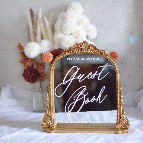 Wedding Guestbook Mirror | Wedding Signage | Modern Wedding Sign | Guest Book Sign | Elegant Wedding Decor | Welcome Table Sign Description Our elegant, timeless Guest Book sign is the perfect decorative touch for your wedding. Additionally, this wedding sign is not only decorative but is also informative and is typically placed near the guest book. Magnolia Dreams has the design capability to work with various designs and wordings, but generally this sign is formatted in a way where 'Guest Book Wedding Mirror Sign You Look Good, Picture Frame Signs Wedding, Guest Sign In Table Wedding, Gold Mirror Sign Wedding, Wedding Gold Mirror, Wedding Guest Book Sign Mirror, Mirror Wedding Signage, Vinyl Record Guest Book Sign, Welcome Table Wedding