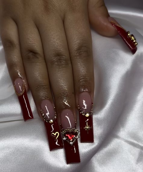 Red Nail Designs Y2k, Red Heart Charm Nails, Red Nails Acrylic Ideas, Dark Red Tapered Square Nails, Dark Cherry Red Nails Acrylic Design, Gold And Red Acrylic Nails, Red Nails With Gold Charms, Dark Red Nails With Charms, Black Nails With Gold Charms