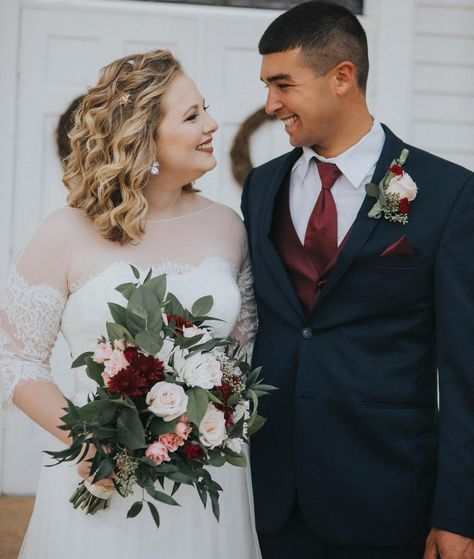 Burgundy, blush, white and cream wedding scheme come alive with this Bridal Bouquet and Boutonnière made with quicksand and blush pink roses, white and burgundy mums and mixed greenery. Bride And Groom Bouquet, Burgundy And Blush Corsage, Wedding Boutineers Burgundy, Wine Blush And Ivory Wedding, Burgundy And White Boutonniere, Burgundy And Blush Boutonniere, Burgundy Blush And Greenery Wedding, Burgundy And Blush Wedding Groomsmen, Burgundy And Cream Wedding