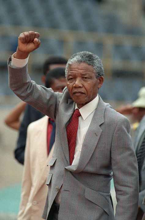 Nelson Mandela raises clenched fist, arriving to address mass rally, a few days after his release from jail, 25 February 1990, in the conservative Afrikaaner town of Bloemfontein, where ANC was formed 75 years ago. (Photo credit should read TREVOR SAMSON/AFP/Getty Images) Nelson Mandela Pictures, African Empires, Nelson Mandela Day, Black Liberation, Black Samurai, Content Inspiration, Pan Africanism, First Ladies, Black Presidents