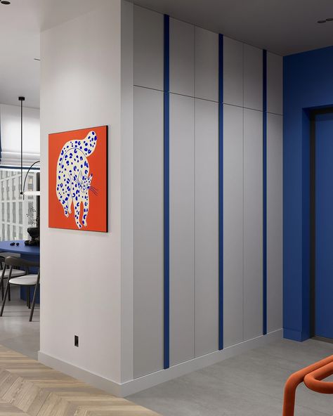 Modern apartment hallway design with bold and vibrant colours. The deep royal blue accent wall highlights the entry door and contrasts with orange furniture and wall art. 

Marketing imagery by @wonderender Modern Apartment Hallway, Modern Apartment Entryway, Apartment Hallway Design, Royal Blue Accent Wall, Entryway Wardrobe, Apartment Hallway, Blue Accent Wall, Orange Furniture, Blue Accent Walls