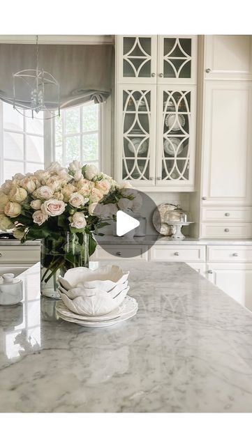 Mary Ellen Becker on Instagram: "My very favorite white paint! Benjamin Moore China White is all throughout the house, but I especially love it in the kitchen. A few dozen fresh spray roses and about to bike ride on this 75 degree day! Happy almost-summer! 🤍 What are you up to this weekend? ☀️ Kitchen cabinet paint: China White from @benjaminmoore Kitchen Cabinet interior and Kitchen Island: Galveston Gray from @benjaminmoore Kitchen countertops: Polished Carrara Marble Kitchen Backsplash: Honed Carrara Marble #kitchen #kitchendesign #paintcolors #carraramarble" White Paint Benjamin Moore, Benjamin Moore China White, Marble Kitchen Backsplash, Paint Benjamin Moore, Carrara Marble Kitchen, Kitchen Cabinet Paint, Kitchen Cabinet Interior, Marble Backsplash Kitchen, Cabinet Interior