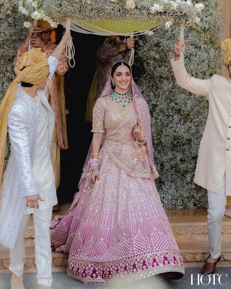 @kiaraaliaadvani looking absolutely gorgeous walking down the aisle to the love of her life @sidmalhotra 💫 We love her stunning lehenga in the hues of pink paired with contrasting emerald jewelry 😍 Kiara Wedding, Pink Bridal Lehenga, Latest Bridal Lehenga, Indian Outfits Lehenga, Wedding Lehenga Designs, Bridal Lehenga Collection, Walk Down The Aisle, Indian Bridal Dress, Traditional Indian Outfits