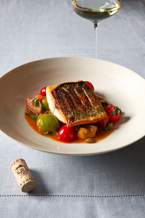 67 Pall Mall's fillet of wild sea bass with heritage tomatoes, anchovies and capers  | Lunch and Dinner | Recipes | Luxury London Heritage Tomatoes, Sea Bass Recipes, Lunch And Dinner Recipes, Wild Sea, Wine And Food, Bistro Food, Fine Dining Recipes, Pub Food, Luxury London