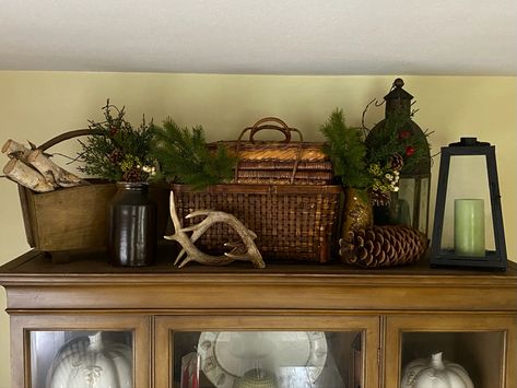 Corner Hutch Christmas, How To Decorate Top Of Armoire In Bedroom, Christmas Decor Ideas For Top Of Entertainment Center, Christmas Decor On Top Of Hutch, Winter Hutch Decor, Hutch Christmas Decorating Ideas, Top Of Armoire Decor, Decorating Top Of Hutch, Western Bookshelf