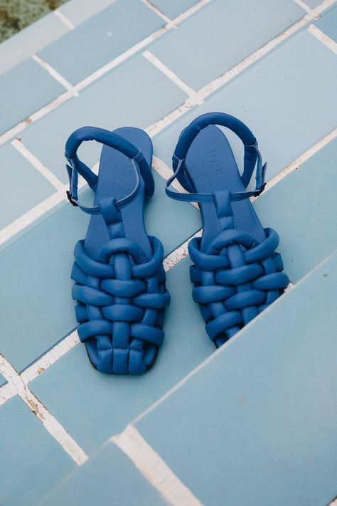 Blue padded flat fisherman sandal crafted in soft lambskin.  Handmade in Spain by uniquely talented artisans, celebrating excellence in craftsmanship.      - Colour: Blue - Square toe - Leather outsole with rubber heel - Heel height: 0,5 cms - Cushioned leather footbed        European sizing. Fits true to size, for hal