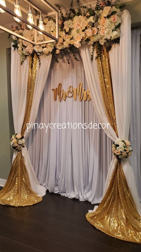 By PinayCreationNDecor https://m.facebook.com/pinaycreationsndecor/?tsid=0.45883276357287106&source=result Graduation Aisle Decor, Gold Wedding Altar, Gold Backdrop Ideas, Wedding Floral Backdrop, Main Table Wedding, Rose Gold White Wedding, Curtain Backdrop, Small Weddings Ceremony, White Wedding Decorations