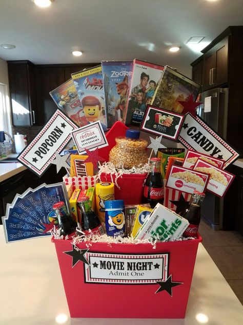 Movie Mania Gift Basket Family Movie Night Gift, Movie Basket, Movie Basket Gift, Diy Christmas Baskets, Movie Night Basket, Auction Gift Basket Ideas, Fundraiser Baskets, Budget Friendly Christmas Gifts, Theme Baskets