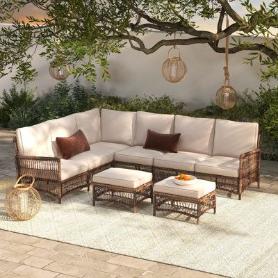 The perfect addition to any patio, deck, or sunroom, this all-weather wicker 6-person sectional seating set is made from durable, weather-resistant wicker and features plush, comfortable cushions. The set includes a sectional sofa and two ottomans. The modular design allows you to arrange the pieces in a variety of configurations to suit your needs. | Ebern Designs Direnzo 98" Wide Outdoor 6 - Person Outdoor Wicker L-Shaped Patio Sectional w / Cushions Wicker / Rattan in Brown | 32.7 H x 98 W x Sunroom Sectional Sofa, Rattan Sectional Sofa, Outdoor Couches Patio, Chic Patio Furniture, Deck Sectional, Deck Furniture Ideas, Patio Furniture Decor, Cozy Outdoor Seating, Patio Sectional Furniture