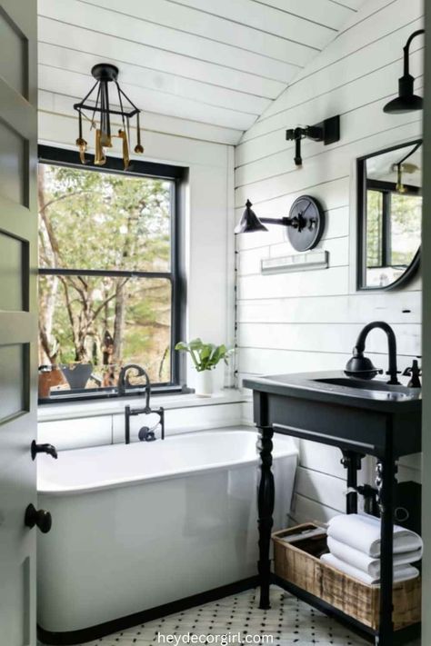 15 Amazing Black And White Farmhouse Bathroom Decor Ideas - Hey Decor Girl [Latest Trending Decor Design Ideas] Black And White Farmhouse Bedroom, Black And White Farmhouse Bathroom, White Farmhouse Bedroom, Mixing Modern And Farmhouse, White Farmhouse Bathroom, Black Faucets, Black And White Farmhouse, Farmhouse Bathroom Decor Ideas, Matte Black Faucet