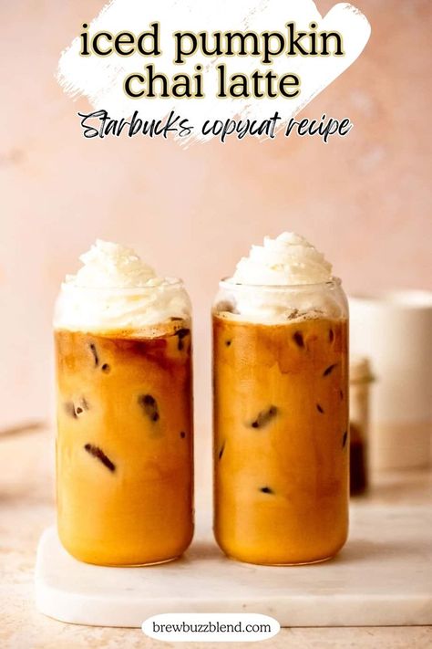 Two iced pumpkin chai lattes topped with whipped cream sitting on a marble slab. Pumpkin Chai Latte Starbucks, Flavored Latte Recipes, Pumpkin Chai Tea Latte, Pumpkin Chai Latte Recipe, Chai Latte Starbucks, Pumpkin Chai Latte, Pumpkin Chai Tea, Copycat Drink Recipes, Chai Tea Latte Recipe