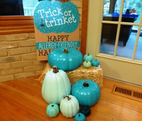 Spray painted pumpkins for the "Teal Pumpkin Project".  Bought a bunch of plastic pumpkins on clearance last November. Then pray painted them different colors of teal.  Added a neat sign and now i am ready to hand out non-food treats this halloween. Teal Pumpkin Trunk Or Treat Ideas, Teal Pumpkin Decor, Teal Pumpkin Ideas, Teal Halloween, Teal Pumpkin Project, Halloween Arts, Halloween Foods, Teal Pumpkin, Plastic Pumpkins