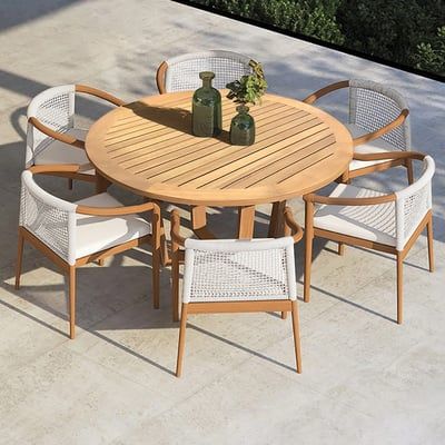 Elevate your outdoor dining with this 7-piece teak set featuring a round table and 6 comfortable sling-seat armchairs. Crafted from durable teak wood, it's perfect for any porch, patio, or yard. Outside Dining Table, Dining Table With 6 Chairs, Modern Outdoor Dining Sets, Table With 6 Chairs, Modern Outdoor Dining Table, Wood Round Dining Table, Round Table And Chairs, House Images, Round Wood Dining Table