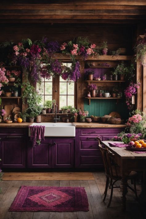 Discover a slice of paradise in this majestic floral-infused rustic kitchen. Dark wooden beams and log walls evoke a cabin feel, while resplendent purple cabinetry and a farmhouse sink add modern flair. Cascades of verdant greenery and vibrant flowers drape from above, creating an ethereal atmosphere. A weathered wooden table, adorned with fresh fruits and blooms, awaits warm gatherings. The charming open shelves exhibit earthenware amidst the foliage. Witchy Studio, Witchy Farmhouse, Studio Seni, Library Kitchen, Witchy Apothecary, Apothecary Kitchen, Whimsical Kitchen, Witchy Home, Purple Kitchen