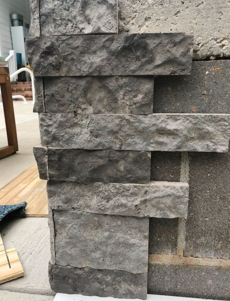 Start stacking Airstone on the corner Covering Block Foundation, How To Cover A Cinder Block Wall, How To Cover Cinder Block Exterior, Cinder Block Retaining Wall Makeover, Cinder Block Cover Up Ideas, Foundation Covering Ideas, House Foundation Covering Ideas, Cinder Block Foundation, Stone Panels Exterior