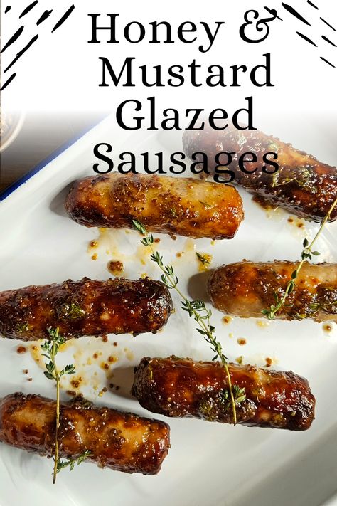 Honey, mustard, & pork are combined so often that it could be considered a holy trinity. These honey & mustard glazed sausages prove it. There’s no reason you couldn’t substitute the pork sausages for a beef, chicken sausage, or any other sausage you like, even a veggie sausage. However, pork’s fat content makes it the ideal meat for a sausage, which the other alternatives fail to replicate. Honey And Mustard Sausages, Honey Glazed Sausages, Honey Mustard Cocktail Sausages, Honey Mustard Sausages, Glazed Sausages, Easy Canapes, White Sausage, Pork Sausages, Honey Mustard Glaze