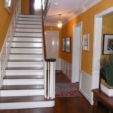 Purple Hallway, Paint Over Wood Paneling, Yellow Hallway, Wainscoting Height, Hallway Paint, Creative Wall Design, Victorian Hallway, Guest Bedroom Remodel, Dining Room Wainscoting