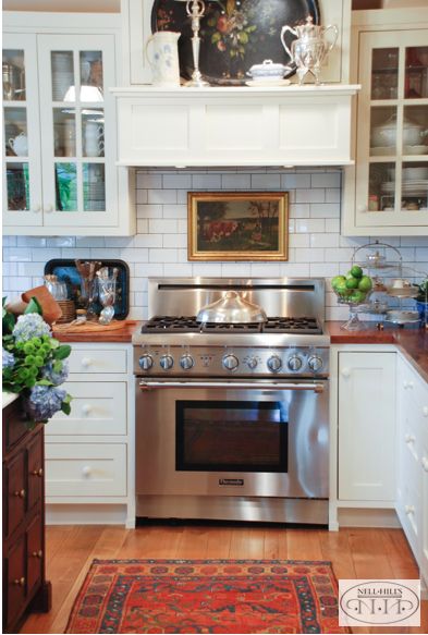 Since I never use my stove, I was able to dress up the space above the range with a painting. Stove Decor, Kitchen Design Color, Houses Ideas, Cottage Kitchens, Classic Kitchen, Kitchen Farmhouse, Dream Houses, Kitchen Wall Decor, White Cabinets