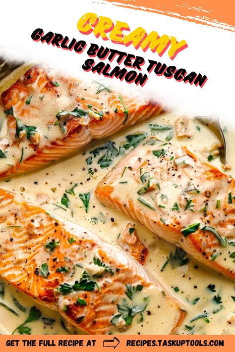 Indulge in the rich flavors of Creamy Garlic Butter Tuscan Salmon, a gourmet dish that brings the taste of Italy to your dinner table. This easy-to-follow recipe features tender salmon fillets smothered in a luscious garlic butter sauce, complemented by sun-dried tomatoes and fresh spinach. Perfect for a weeknight meal or special occasion, this dish offers a delightful fusion of creaminess and savory goodness. Elevate your cooking with this mouthwatering recipe that promises to impress family and friends alike Creamy Garlic Butter Tuscan Salmon, Smothered Salmon Recipe, Salmon With Creamy Spinach Sauce, Salmon And Ravioli Recipes, Salmon Tuscan Recipe, Creamy Garlic Butter Salmon, Creamy Garlic Tuscan Salmon, Creamy Tuscan Salmon, Creamy Spinach Sauce