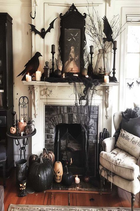 Create an enchanted Halloween scene with magical fireplace decor. Pumpkins, bats, and mystical elements bring a fairy-tale feel to your living room. Check out more Halloween fireplace decor living room ideas and follow us for more inspiration! Living Room Halloween Decor, Halloween Living Room Decor, Halloween Mantel Decor, Halloween Mantle Decor, Halloween Fireplace, Halloween Living Room, Victorian Halloween, Halloween Decor Ideas, Casa Halloween