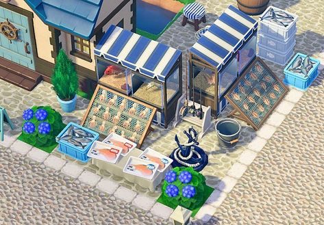 Ariii 🌸💐’s Instagram photo: “Hugh’s fish market 🎣 DA in bio!! Sorry for posting so many times today, I swear this is it 🤣 Blue and white stall code by @suiyuyu…” Acnh Blue Island Ideas, Acnh Fish Stall Design, Acnh Coastal Town Ideas, Acnh Coastal Ideas, Animal Crossing Coastal Theme, Acnh Mediterranean Island, Animal Crossing Blue Aesthetic, Coastal Animal Crossing Island, Animal Crossing Coastal Town