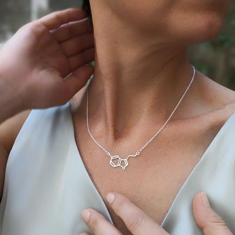 Find your balance and boost your mood with our molecule necklaces! Serotonin for happiness, caffeine for a spark of joy. Wear a little bit of pleasure every day! #MoleculeNecklaces #Happiness #Balance #Serotonin #Caffeine #molecule #endocrinology #endocrinologia #sciencelover #chemist #chemistry #meaningful #serotonina #coffelove #coffeelovers #coffeeaddict #happynessmood #moodmagic #molecole #symbols #giftnecklace #birthdaygiftideas #lovejewelry #sterlingsilver #silvershop #collaneargento... Molecule Necklace, Science Lover, Silver Shop, Birthday Gift Ideas, Coffee Addict, Gift Necklace, Coffee Lover, Finding Yourself, Sterling Silver