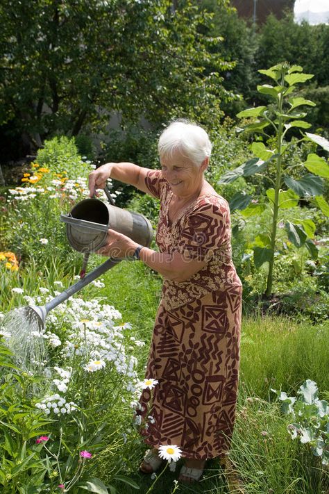 Summer day. Grandmom is watering the flowers in her garden , #SPONSORED, #Grandmom, #day, #Summer, #garden, #flowers #ad People Gardening, Summer Garden Flowers, In Her Garden, Grandma And Grandpa, Old People, Garden Flowers, Style Mistakes, Summer Garden, Summer Day