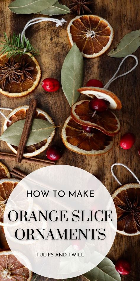 orange slice ornaments on a wooden table top with supplies scattered about Orange Christmas Ornaments Dried Fruit, Dried Orange Slices Decoration Christmas Tree, How To Make Orange Slice Ornaments, Diy Dried Fruit Ornaments, Orange Slice Christmas Ornaments, Old Fashioned Ornaments Diy, How To Make Dried Orange Slices Christmas Decorations, How Do You Dry Orange Slices, How To Dry Orange Slices In Air Fryer