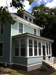 Our American Foursquare house with her new pale aqua paint job.  Sherwin Williams Quietude and Dovetail.  Via Circa 1900. Sherwin Williams Quietude, Delhi House, 1900 House, Foursquare House, Craftsman Remodel, Four Square Homes, American Foursquare, Enclosed Porch, Aqua Paint