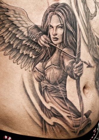 30 Best Warrior Tattoo Designs And Meanings With Pictures | Styles At Life Angel Girl Tattoo, Guardian Tattoo, Angel Warrior Tattoo, Archer Tattoo, Guardian Angel Tattoo Designs, Sagittarius Tattoo Designs, Warrior Angel, Female Warrior Tattoo, Valkyrie Tattoo