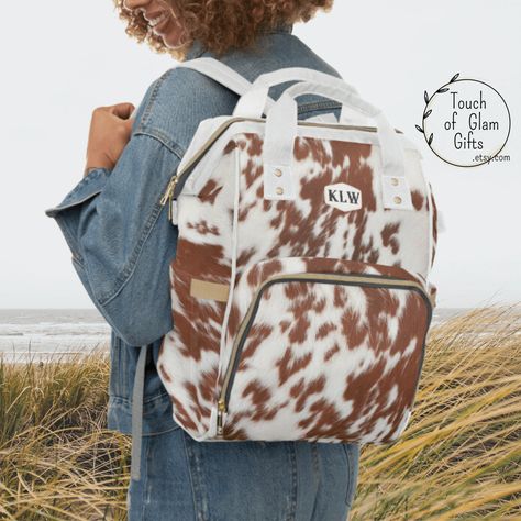 Personalized Cow Print Diaper Backpack, Monogrammed Cowhide Print Backpack,  Laptop Backpack, Travel Bag for Women, Baby Shower Gift for Mom by TouchOfGlamGifts on Etsy Western Diaper Bag, Baby Bags For Mom, Nurse Tote Bag, Hands Free Bag, Cowhide Print, Western Babies, Personalized Backpack, Inside Bag, Wet Wipes