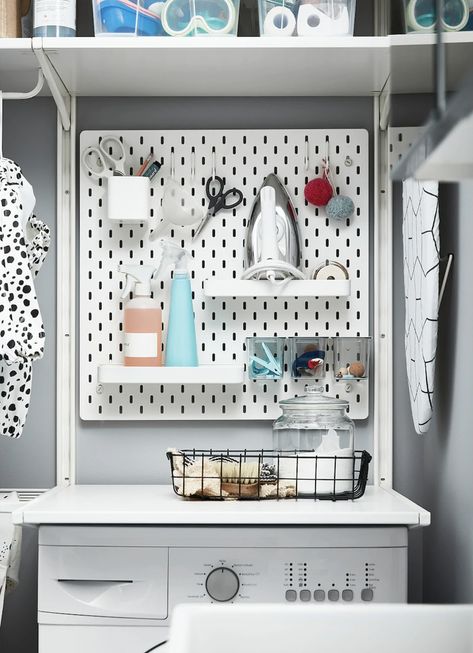 Keep all those small, annoying, but essential, bits organised and keep the space neat using these handy peg boards #storage #hacks #ikeahacks #realhomes Ikea Pegboard Bathroom, Skådis Ikea, Ikea Laundry, Ikea Laundry Room, Tiny Laundry, Kitchen Wall Storage, Tiny Laundry Rooms, Room Storage Diy, Laundry Ideas