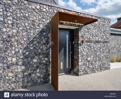 Download this stock image: Entrance to the house. Front elevation with flint and rusted corten steel. House 19, Old Amersham, United Kingdom. Architect: Jestico + Whiles, 2016. - H3EKEK from Alamy's library of millions of high resolution stock photos, illustrations and vectors. Ikea Canopy, Front Door Canopy, Canopy Bedroom, Backyard Canopy, Modern Entrance, Garden Canopy, Door Awnings, Door Canopy, Carseat Canopy