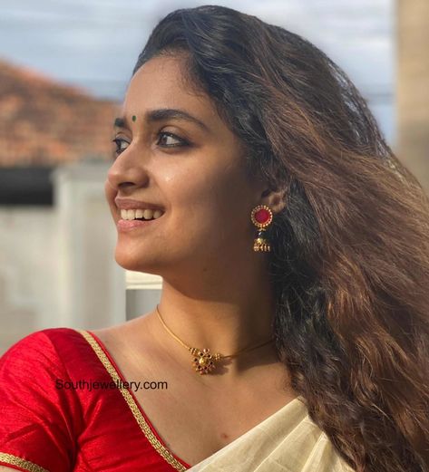 Keerthy Suresh in a simple gold choker and jhumkas