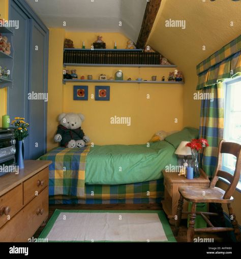 Download this stock image: Pine furniture in childs yellow bedroom with yellow and blue checked linen and curtains - AKFW8X from Alamy's library of millions of high resolution stock photos, illustrations and vectors. Yellow Boys Bedroom, 60s Boys, Boy Vintage, Big Boy Bedrooms, Pine Furniture, Yellow Bedroom, Vintage Bedroom, Boy Bedroom, Boys Bedrooms